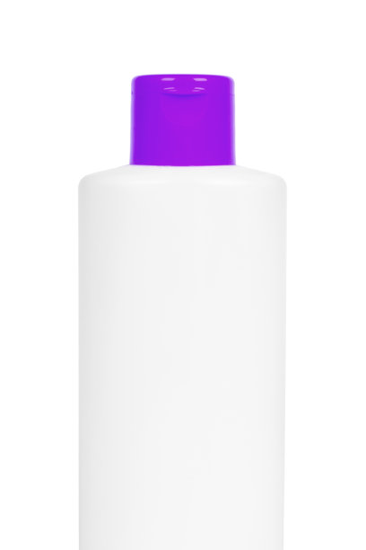 白色塑料香波瓶，橙色盖，孤立在白色背景。护发用发胶。装有身体乳液的容器。半瓶的照片。图片下载