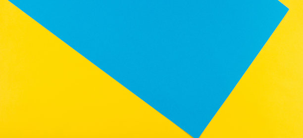 抽象几何黄色和蓝色纸背景。图片下载