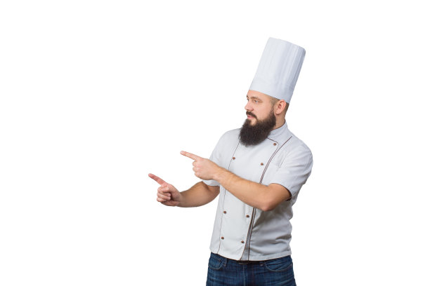 迷人的年轻男厨师厨师指着白色的制服在白色的背景图片下载