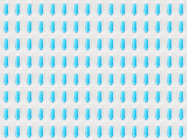 吸塑包装的蓝色胶囊丸的医学背景纹理。药品，无缝模式与成堆的药丸在银泡包装。医疗用品特写俯视图图片下载