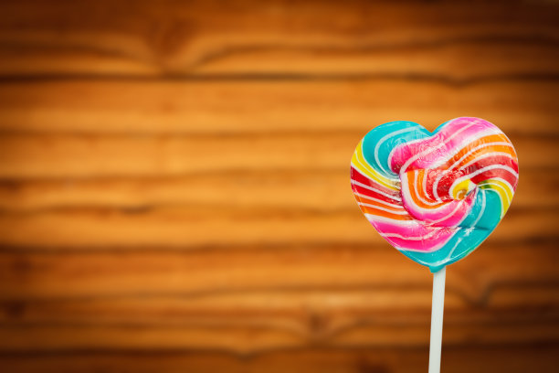 五彩缤纷的心形棒棒糖情人节背景图片下载