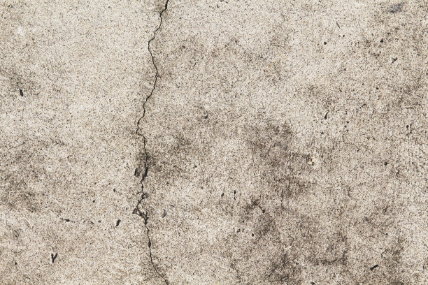 枯燥乏味的混凝土结构。米色沥青路面俯视图照片。破旧过时的背景纹理。图片下载