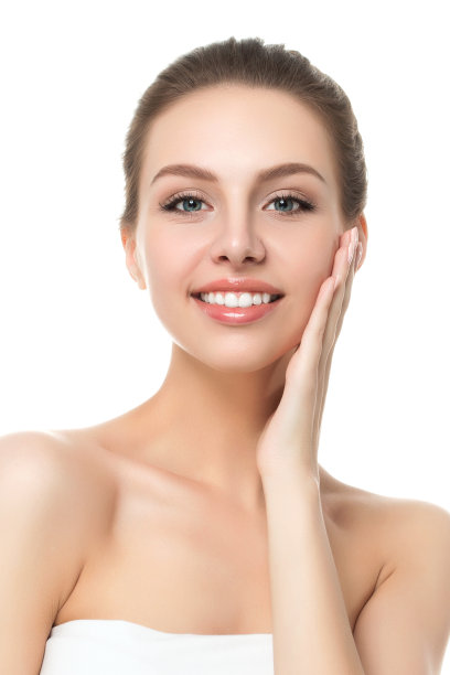 年轻美丽的白人妇女抚摸她的脸的肖像图片下载