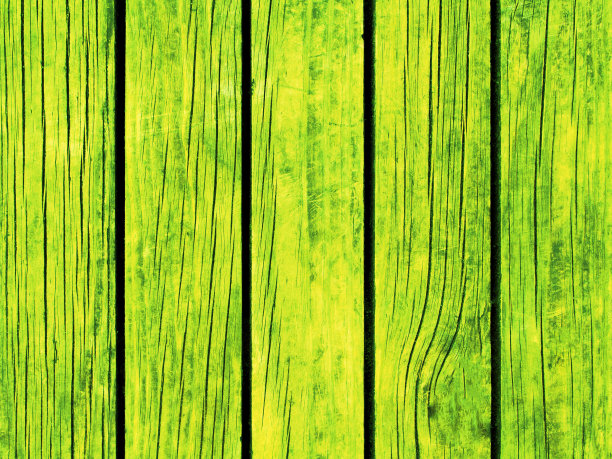 霓虹绿色色调的木质背景。彩色木材表面模板。图片下载