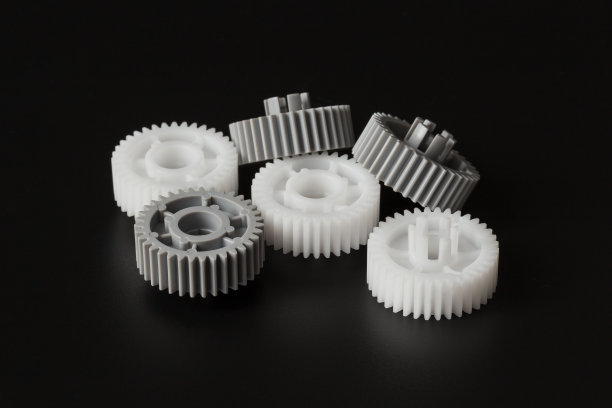灰色和白色塑料齿轮图片下载