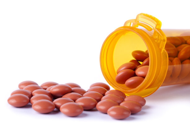 布洛芬从瓶子里洒了出来图片下载