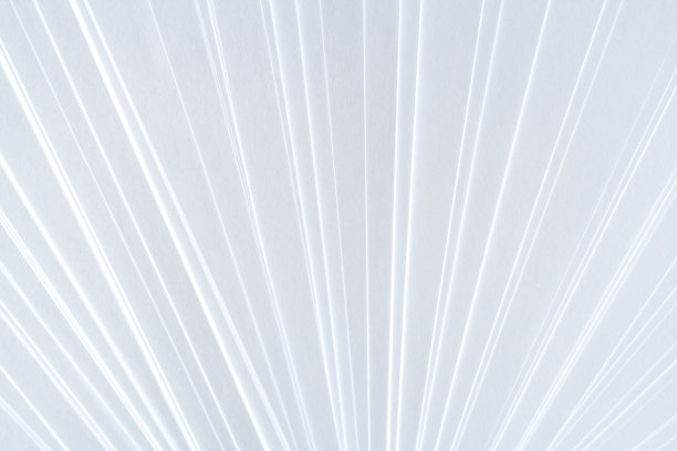 白色对称的几何图案的干净的纸，间距为扇形。素材图片