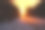 在暴风雪中，汽车在夕阳下行驶在冬日的雪道上图片下载