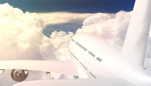 大型商用飞机在云层上空飞行的后视图图片下载