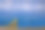 出口文字和硬币堆叠在木桌上，从空中俯瞰海景和货轮，进出口概念。素材图片