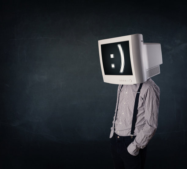 有趣的年轻商人，头上戴着显示器，屏幕上有笑脸图片下载