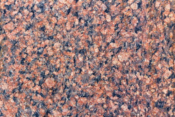 花岗岩纹理特写。天然花岗岩石材的纹理图片下载