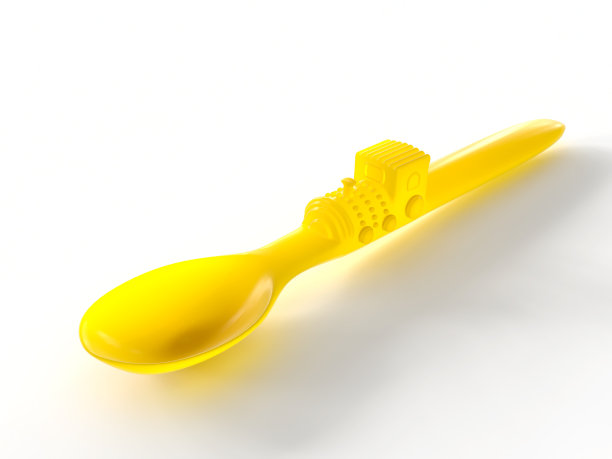 柔软的黄色硅胶勺与训练儿童图片下载