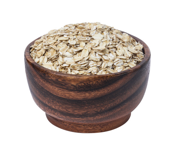 孤立的燕麦片。木碗中的燕麦片，背景为白色图片下载