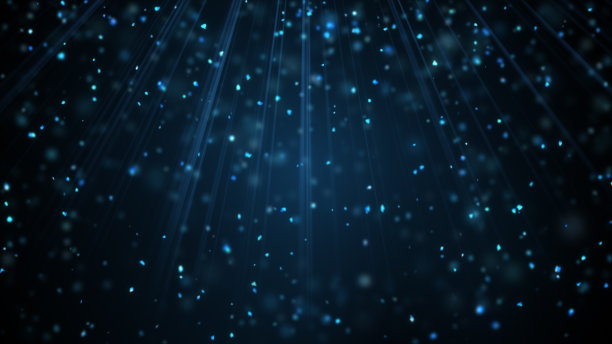 光束中飘落的蓝色雪花颗粒素材图片