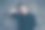 近距离的肖像年轻非常可爱的男人模特在黑色的服装。他严肃的脸，摸着脖子，身后是灰色的背景图片下载