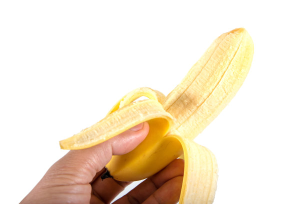 特写香蕉皮在手孤立的白色背景图片下载
