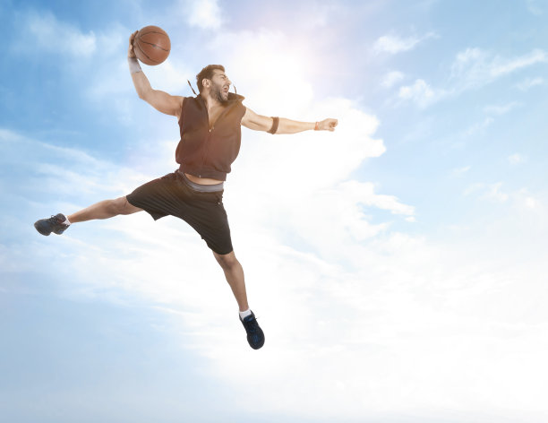 街头篮球运动员做灌篮图片下载