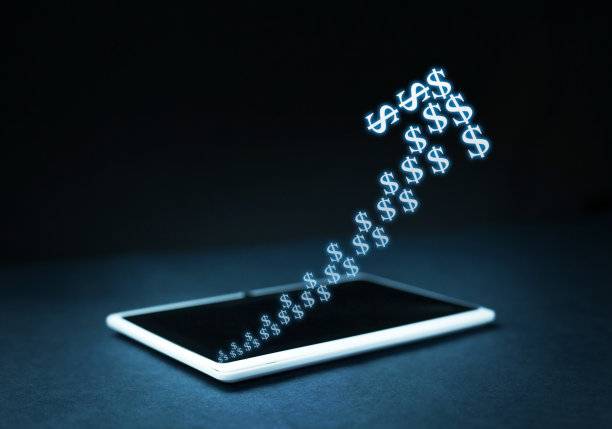 数字平板电脑屏幕上的美元箭头。货币增长的概念。图片下载