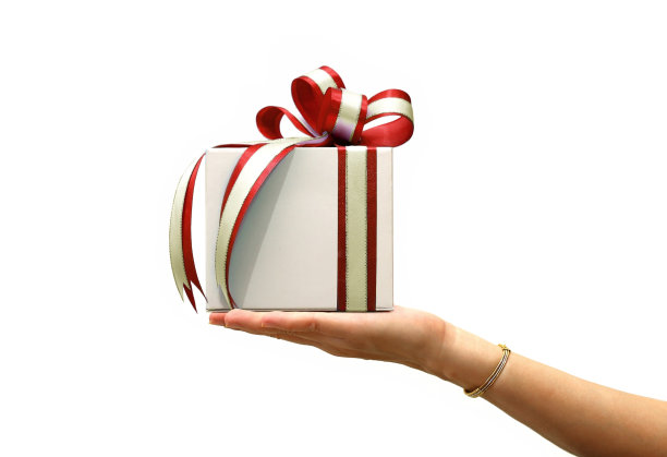 手握礼盒与红丝带上的白色图片下载