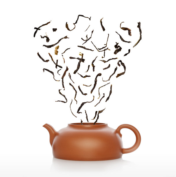 茶壶和中国生茶堆孤立在白色图片下载