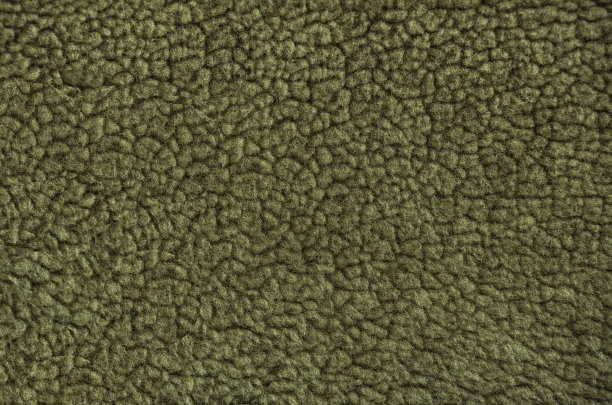 人工的皮毛。黄色毛皮图案背景。宏观材料。图片下载