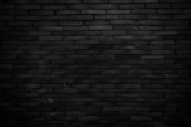 抽象的砖面，黑色的墙背景。图案墙纸或平面设计背景图片下载