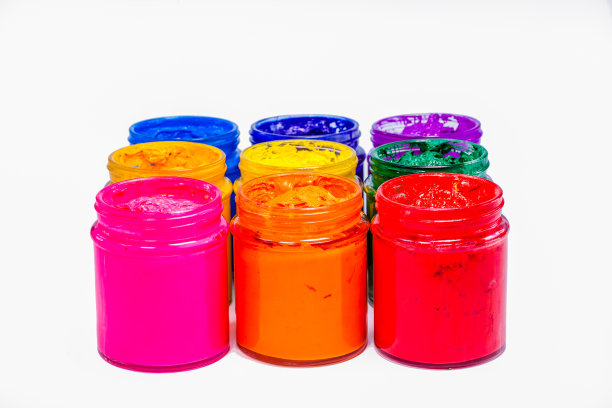 彩色塑料溶胶墨水在玻璃瓶。图片下载