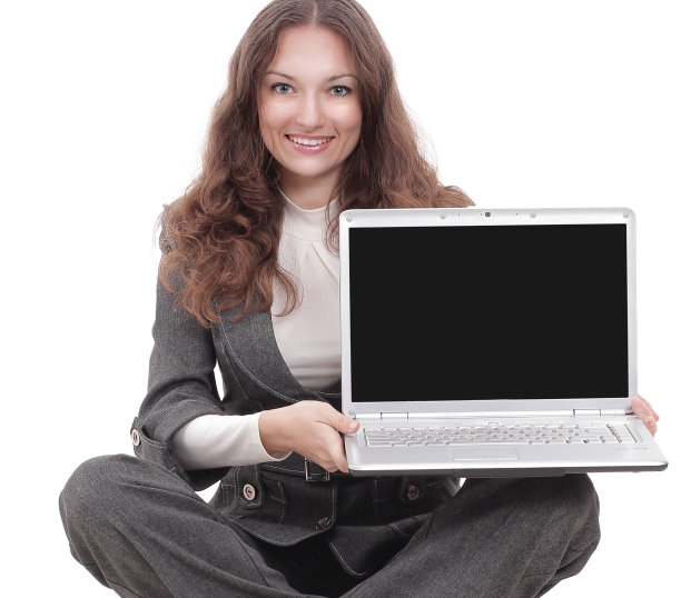 年轻的女商人展示着坐在地板上的笔记本电脑图片下载