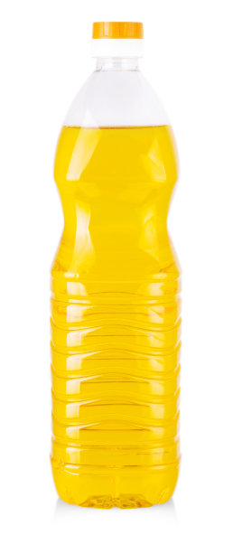 瓶中的向日葵油孤立在白色的背景。图片下载