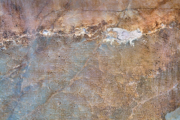 破旧的混凝土墙有裂缝和划痕，背景有纹理。图片下载