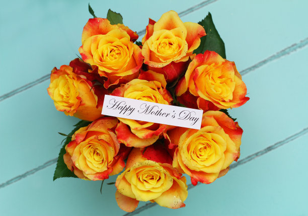 快乐的母亲节卡片，红色和黄色的玫瑰花束覆盖着闪光图片下载