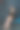 孤独的年轻女子把生日蛋糕放在膝盖上。孤立在黑色的墙壁背景图片下载