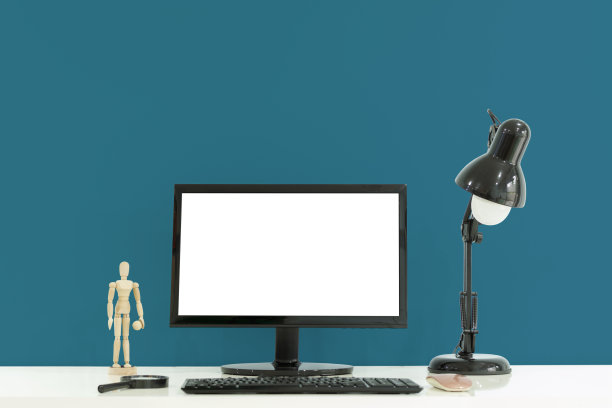 工作桌面白色的桌子和绿色的背景。图片下载