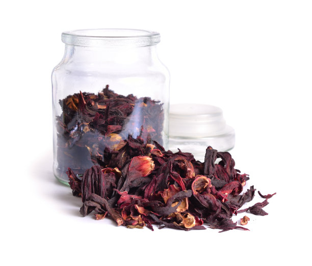 干木槿茶在玻璃罐。孤立在白色背景上。图片下载