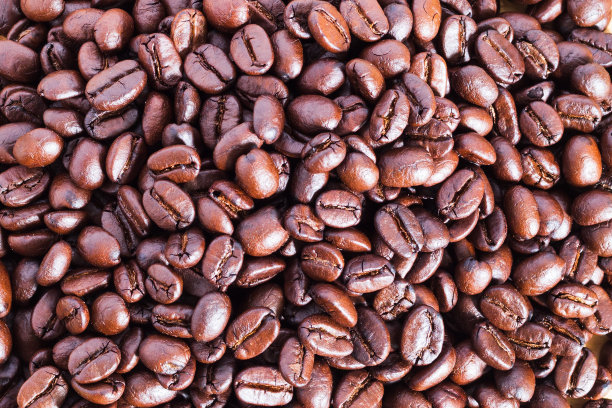 咖啡豆的背景。关闭了。前视图。图片下载
