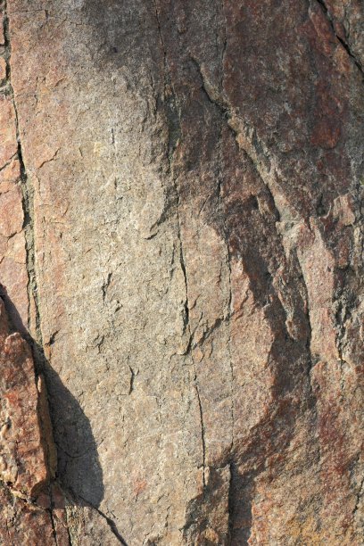 天然石材花岗岩纹理，花岗岩花纹。石材背景斑驳的花岗岩火成岩用于厨房工作台等。大理石表面呈棕色图片下载