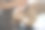 亚洲华人女性宠物美容师用围裙为一只棕色玩具狮子狗梳妆图片下载