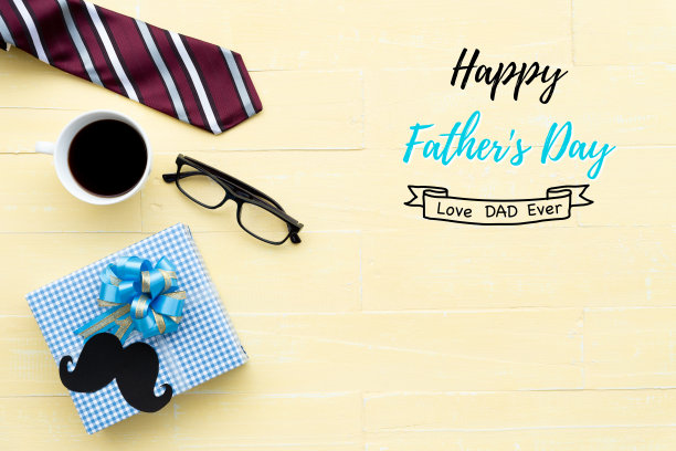 父亲节概念快乐。红色领带，眼镜，胡子，礼盒和咖啡杯在明亮的黄色蜡笔木桌子背景。图片下载