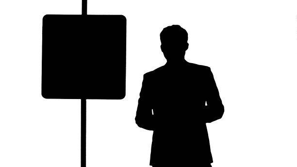 停车标志旁的剪影男子拿着一杯茶图片下载