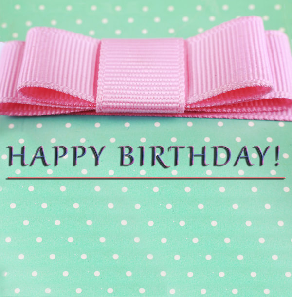 生日快乐。粉色蝴蝶结，蓝绿色背景，圆点花纹。贺卡图片下载