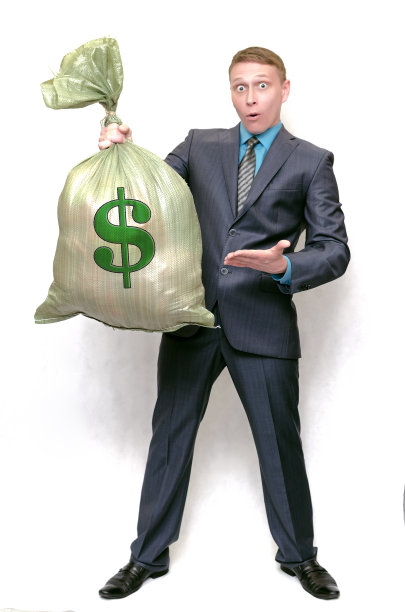 有钱袋的商人。赢家。图片下载