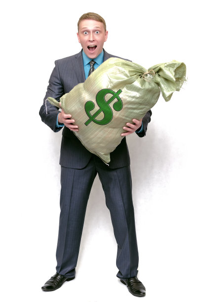 有钱袋的商人。赢家。图片下载