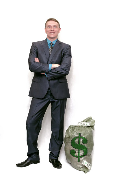 有钱袋的商人。赢家。图片下载