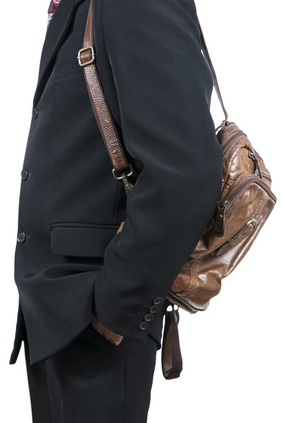 一个背着皮包的商人的肖像图片下载