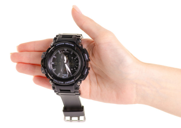 手里拿着运动员的手表图片下载