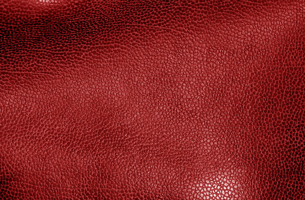 红色的皮革表面。图片下载