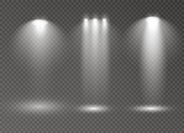 一组金色发光的灯光效果隔离在透明的背景。阳光闪烁着光芒和聚光灯。发出光的效果。星星闪耀着光芒图片下载