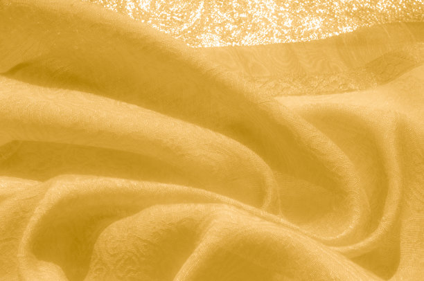 质地、背景、模式。织物-丝光。黄金是黄色的。轻金100%纯丝绸织物Dupioni装饰生印度图片下载