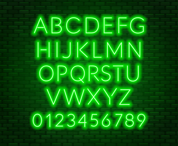 砖墙背景上的霓虹绿色字母。大写字母。图片下载